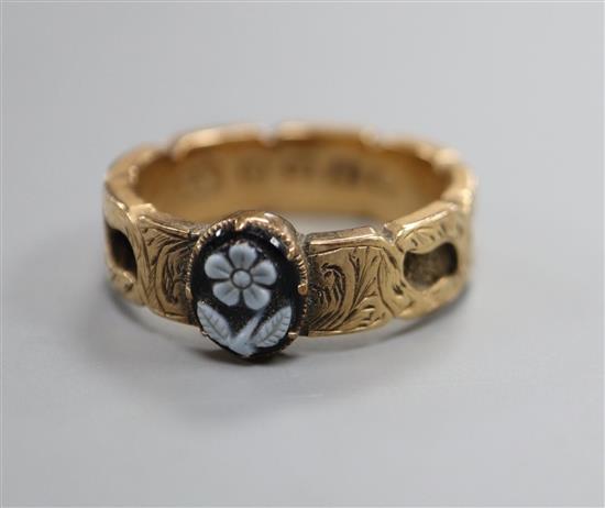 A 19th century 12ct gold and sardonyx cameo set mourning ring, the shank with plaited hair, size O.